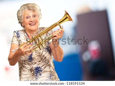 Portrait Of A Senior Woman Holding A Trumpet, Indoor
