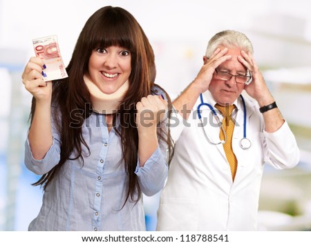 Woman With Euro Note In Front Of Frustrated Doctor, Outdoor
