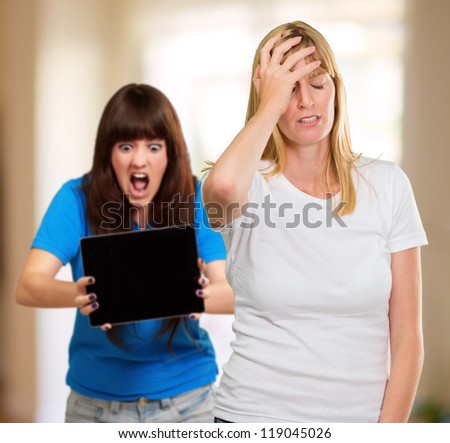 Frustrated Woman In Front Of Shocked Woman, Indoors