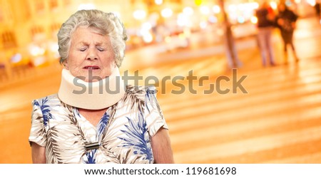 A Senior Woman Wearing A Neck brace, Outdoor