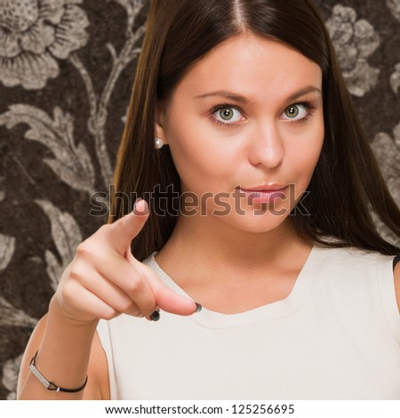 Young Woman Pointing against a vintage background