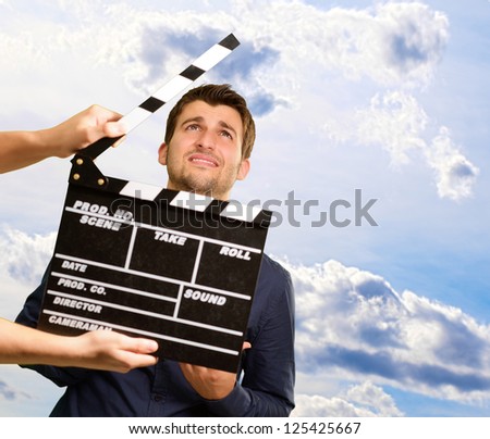 Director Clapping The Clapper Board, Outdoor