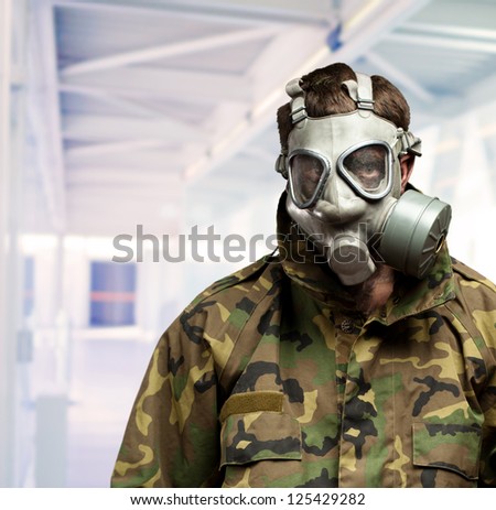 Soldier With Gas Mask in a building