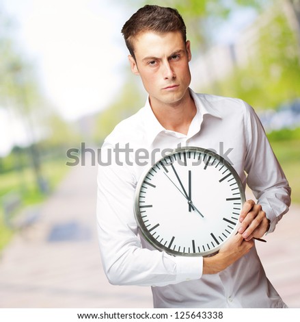 Angry Man Holding Clock In His Hand, Outdoor