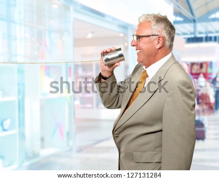 Senior Man Holding Tin, Indoors