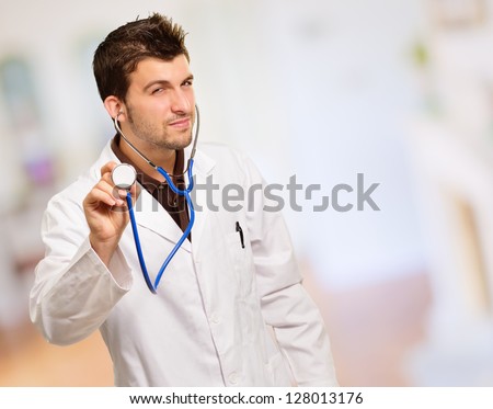 Young Male Doctor Doing Check Up, Indoors