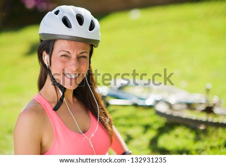 Portrait Of Happy Woman Listening To Music, Outdoors
