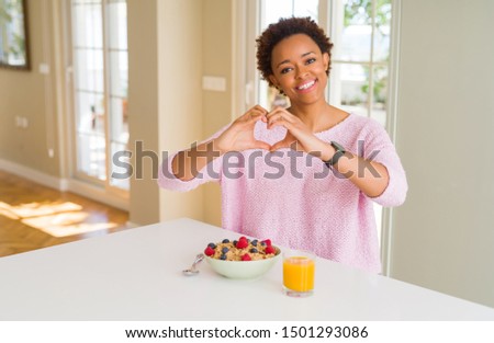 Similar – Image, Stock Photo Cheerful woman having healthy breakfast at home