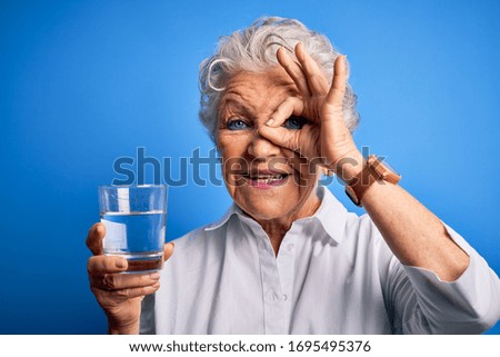 Similar – Image, Stock Photo Funny face through water glass
