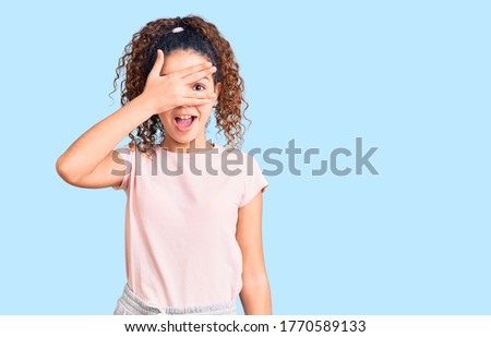 Similar – Image, Stock Photo Little girl covering face with big branch