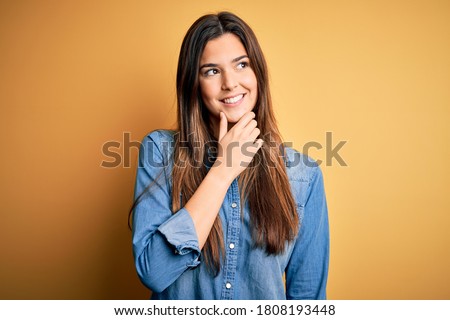 Similar – Image, Stock Photo Thoughtful young woman standing near modern building