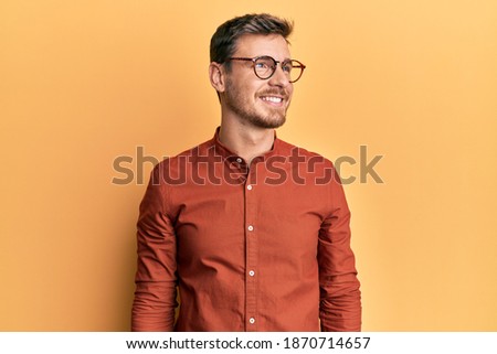 Similar – Image, Stock Photo Profile of a happy male teen texting on a smart phone