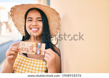 Similar – Image, Stock Photo A girl in a red Christmas hat is making gingerbread dough in the kitchen. Christmas tradition, Christmas atmosphere, preparation for the holiday