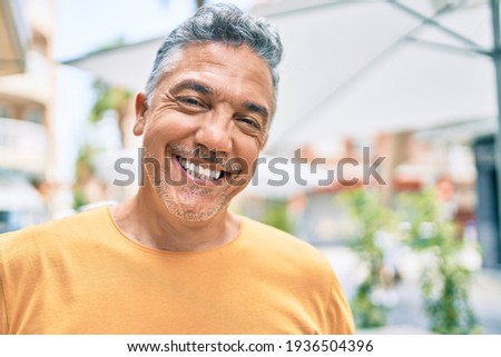 Similar – Image, Stock Photo Portrait of mature man with grey beard exploring Finland in winter. Traveler with camera on the top of rock. Beautiful view of northern landscape with frozen Baltic Sea and snowy islands.