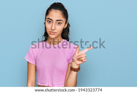Similar – Image, Stock Photo Teenage latin girl wearing casual white t-shirt smiling making frame with hands and fingers with happy face. creativity and photography concept