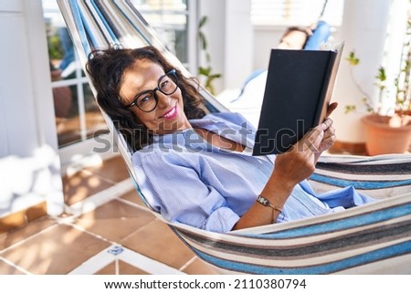 Similar – Image, Stock Photo balcony Reading Literature