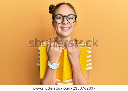 Image, Stock Photo Little hispanic girl studying in front of the laptop. E-learning, study at home online.