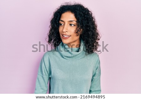 Similar – Image, Stock Photo Lateral portrait of a young woman in front of a red wall