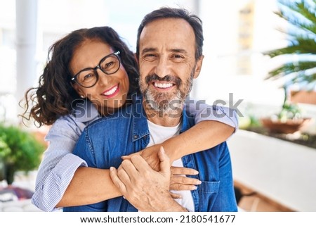 Similar – Image, Stock Photo Loving couple sitting on car on road near forest