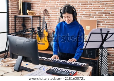 Similar – Image, Stock Photo Smiling woman playing piano in living room