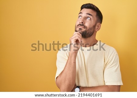 Similar – Image, Stock Photo Pensive young man in black studio with smoke