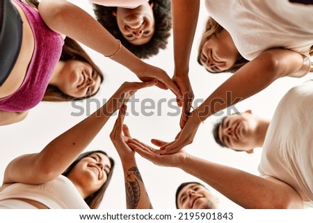 Group of young friends doing circle symbol with hands together Foto stock © 