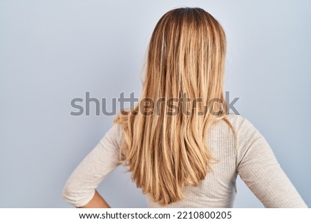 Similar – Image, Stock Photo Rear view blonde woman walking in the evening on field, low sun
