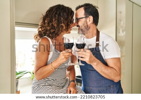 Similar – Image, Stock Photo Couple toasting with glasses of champagne in park