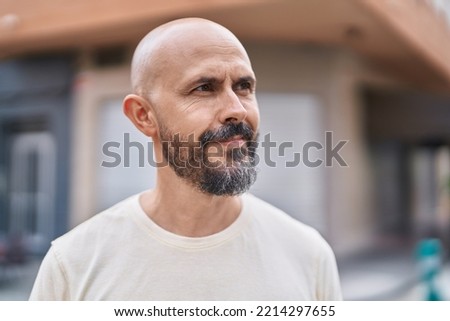 Similar – Image, Stock Photo Bald cool man in pedestrian bridge portrait
