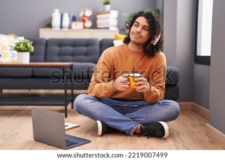 Similar – Image, Stock Photo Latin man listening to music with earphones.