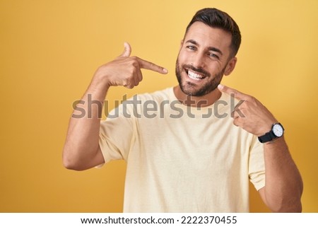 Similar – Image, Stock Photo Young bearded male dentist drilling tooth to female patient