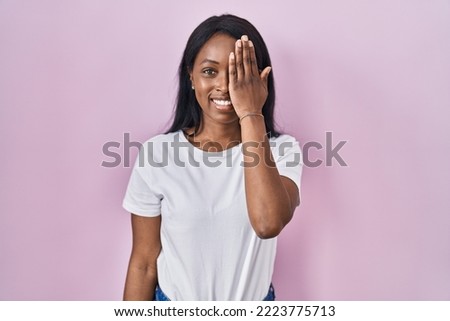 Similar – Image, Stock Photo Cheerful black woman covering eye