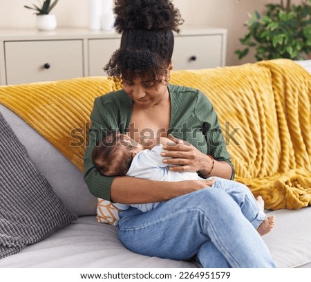 Similar – Image, Stock Photo Happy mother breastfeeding baby near window