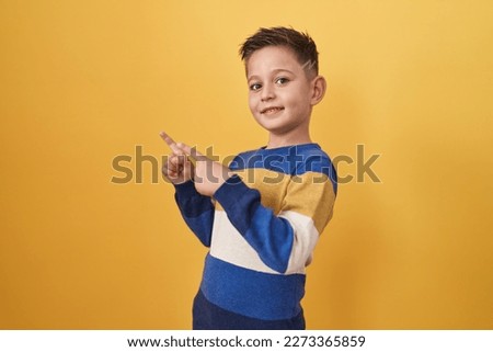 Image, Stock Photo Cheerful little boy with dumbbells