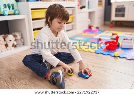 Similar – Image, Stock Photo Serious boy playing on smartphone