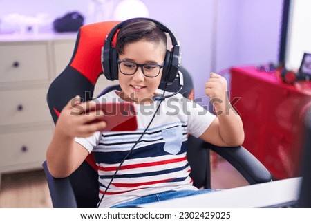 Similar – Image, Stock Photo Little gamer celebrating victory in VR game