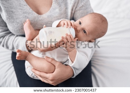 Similar – Image, Stock Photo Mother feeding baby at home