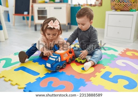 Similar – Image, Stock Photo Adorable toddler girl playing with beach on white sand beach