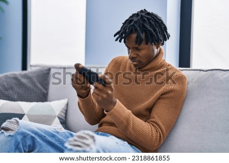 Similar – Image, Stock Photo Concentrated black man playing basketball on court