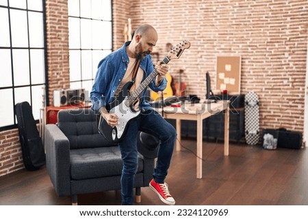 Similar – Image, Stock Photo Guitars in stand in side light