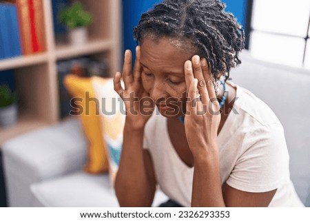 Similar – Image, Stock Photo Upset black woman with dreadlocks against concrete wall