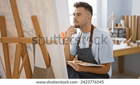 Similar – Image, Stock Photo Hispanic male artist painting picture in workshop