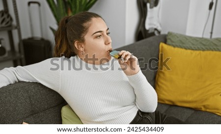 Similar – Image, Stock Photo Modern relaxed woman vaping while sitting on marked road