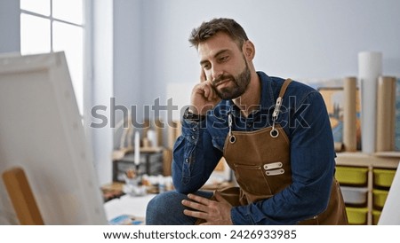 Similar – Image, Stock Photo Hispanic male artist painting picture in workshop