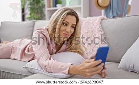 Similar – Image, Stock Photo Happy adult woman taking selfie on top of mountain