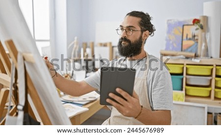 Similar – Image, Stock Photo Hispanic male artist painting picture in workshop