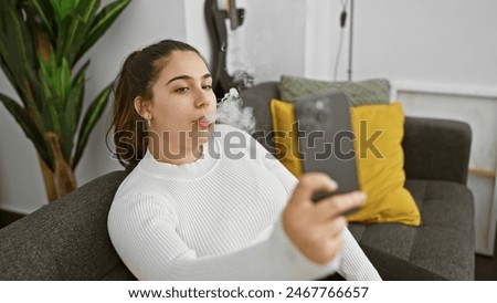 Similar – Image, Stock Photo Modern relaxed woman vaping while sitting on marked road