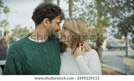 Similar – Image, Stock Photo Ethnic couple embracing against mirror in garden