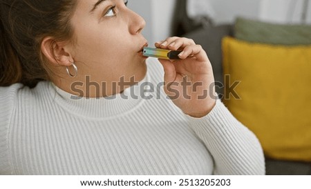 Similar – Image, Stock Photo Modern relaxed woman vaping while sitting on marked road