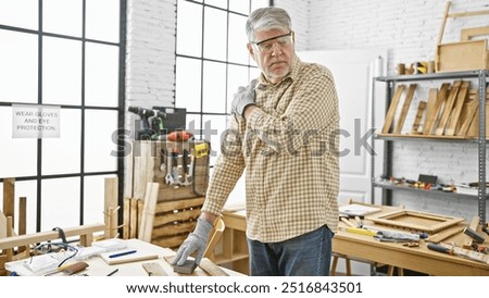 Similar – Image, Stock Photo Senior male woodworker working in garage